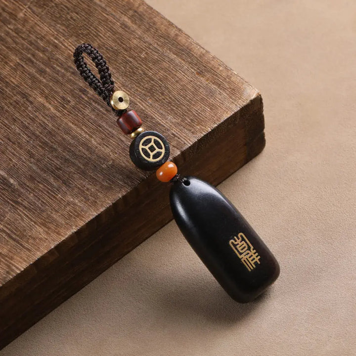 Buddha Stones Small Leaf Red Sandalwood Ebony Wood Peace Auspicious Copper Coin Protection Key Chain - Ebony / Copper