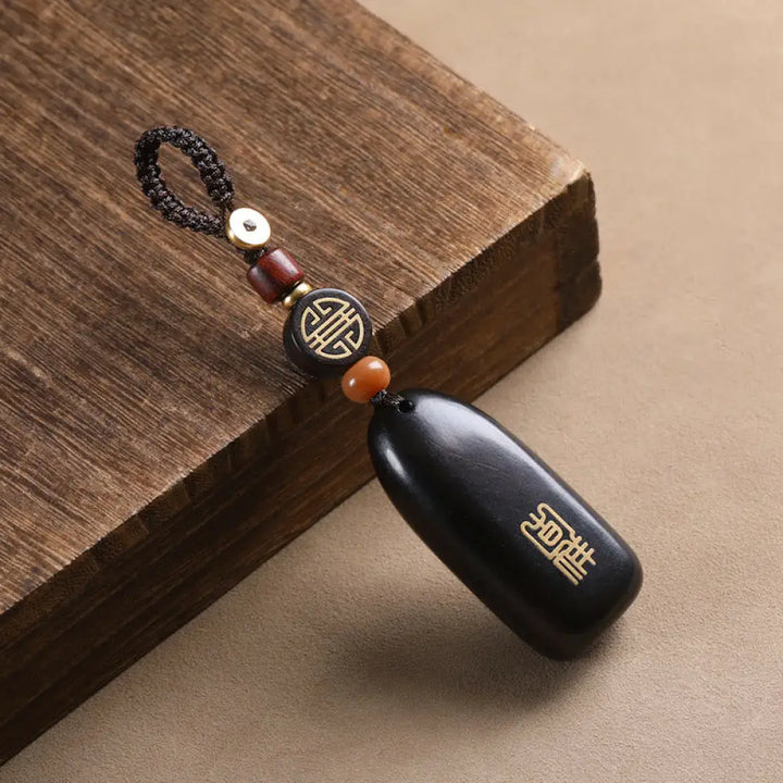 Buddha Stones Small Leaf Red Sandalwood Ebony Wood Peace Auspicious Copper Coin Protection Key Chain - Ebony / Regular