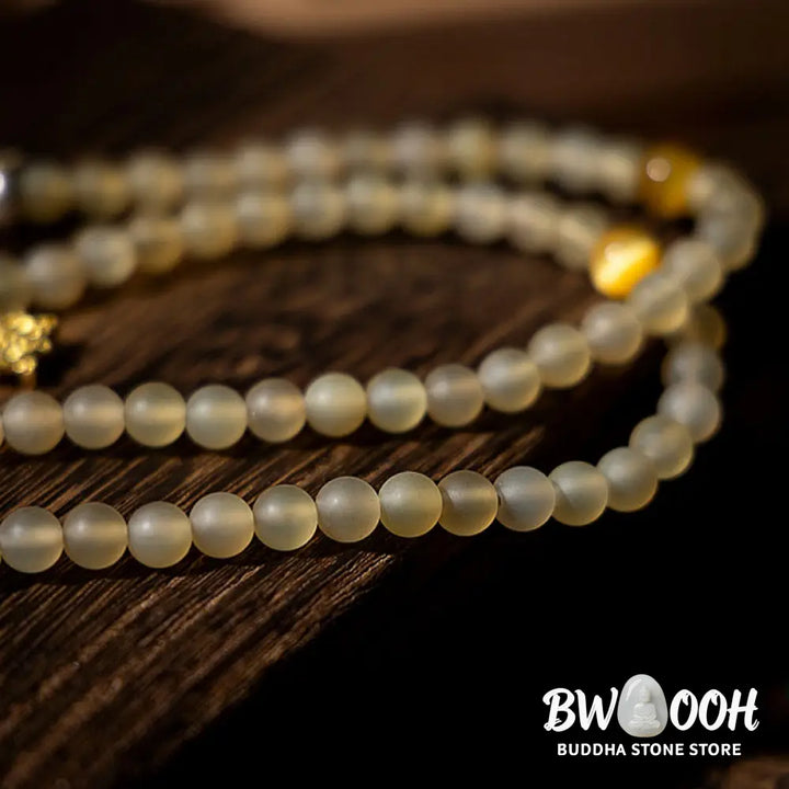 BWOOOH Tibet 108 Mala Beads bracelet featuring natural sheep horn, tiger eye, and Hetian jade with a silver Chinese Zodiac Natal Buddha charm. Sacred amulet for meditation, wealth, protection, and spiritual guidance against negative energy. Elastic string, unisex, 14-16cm wrist. - View 13