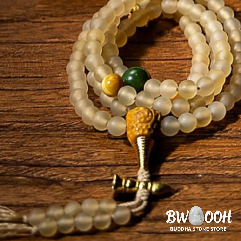 BWOOOH Tibet 108 Mala Beads bracelet featuring natural sheep horn, tiger eye, and Hetian jade with a silver Chinese Zodiac Natal Buddha charm. Sacred amulet for meditation, wealth, protection, and spiritual guidance against negative energy. Elastic string, unisex, 14-16cm wrist. - View 2