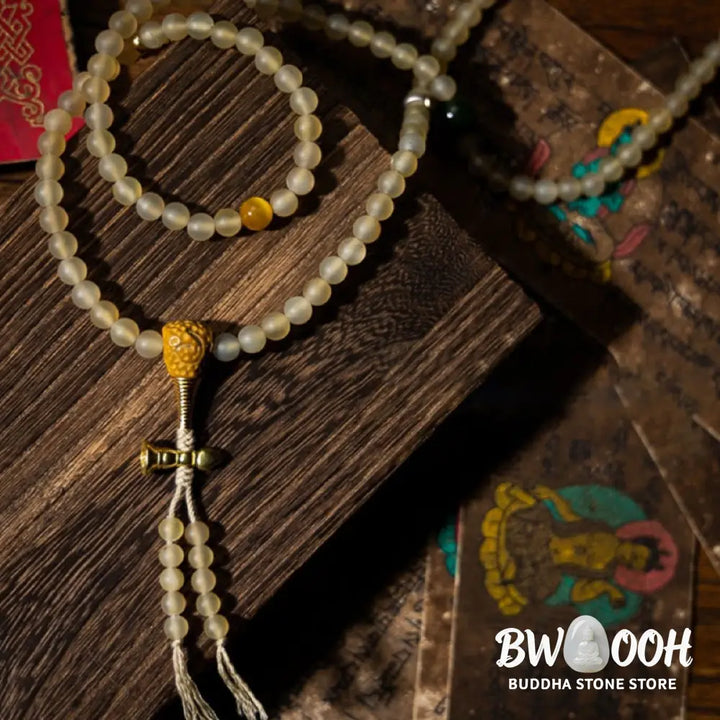 BWOOOH Tibet 108 Mala Beads bracelet featuring natural sheep horn, tiger eye, and Hetian jade with a silver Chinese Zodiac Natal Buddha charm. Sacred amulet for meditation, wealth, protection, and spiritual guidance against negative energy. Elastic string, unisex, 14-16cm wrist. - View 17