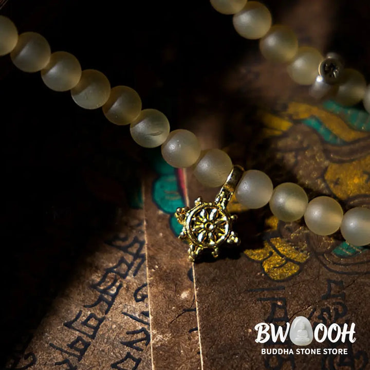 BWOOOH Tibet 108 Mala Beads bracelet featuring natural sheep horn, tiger eye, and Hetian jade with a silver Chinese Zodiac Natal Buddha charm. Sacred amulet for meditation, wealth, protection, and spiritual guidance against negative energy. Elastic string, unisex, 14-16cm wrist. - View 12