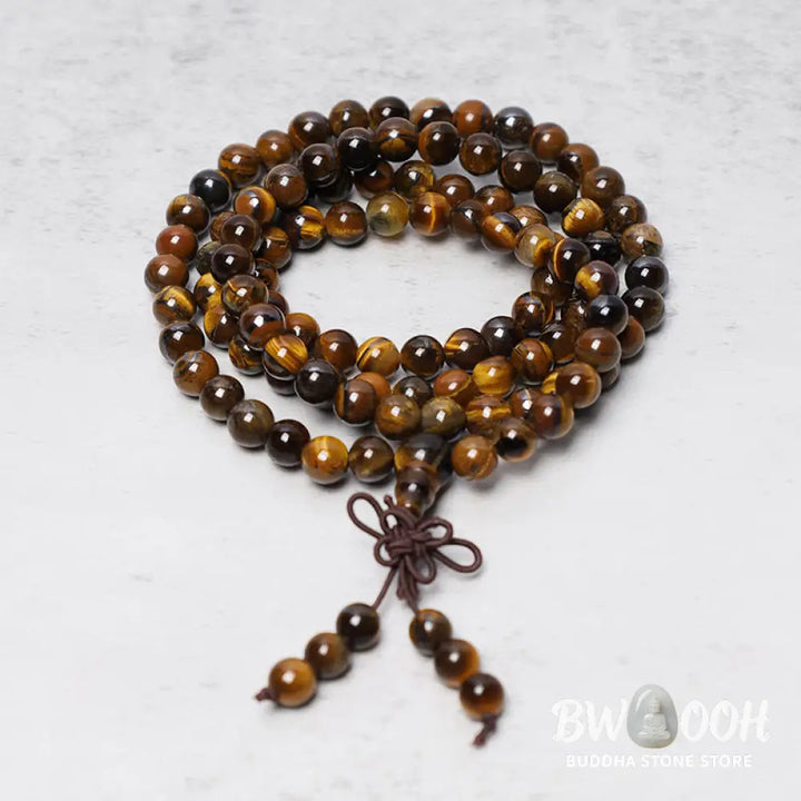 BWOOOH Tibetan 108-bead natural Tiger Eye gemstone prayer mala, handcrafted as a spiritual protection bracelet and necklace, coiled to showcase polished beads. - View 4