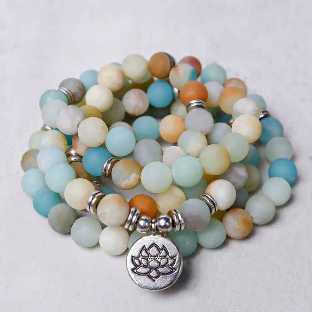 BWOOOH Handcrafted Tibetan Amazonite Lotus Mala with 108 x 6mm beads. A unisex spiritual amulet for meditation, protection, and inner peace.