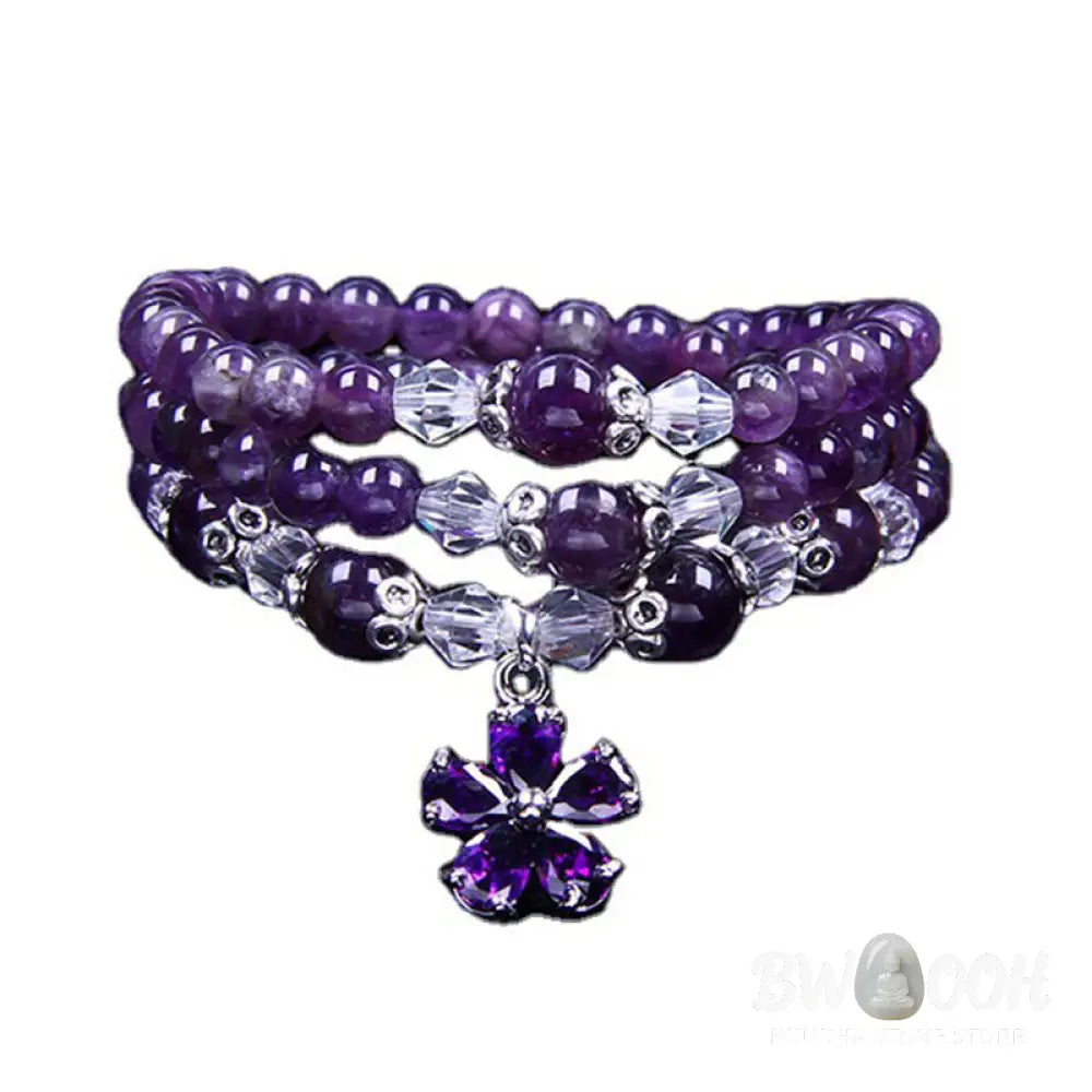 A close-up of the BWOOOH handcrafted Tibetan Amethyst Blessing Bracelet featuring lustrous 6mm natural purple amethyst beads and silver-plated copper accents, symbolizing spiritual protection and inner peace. - View 6