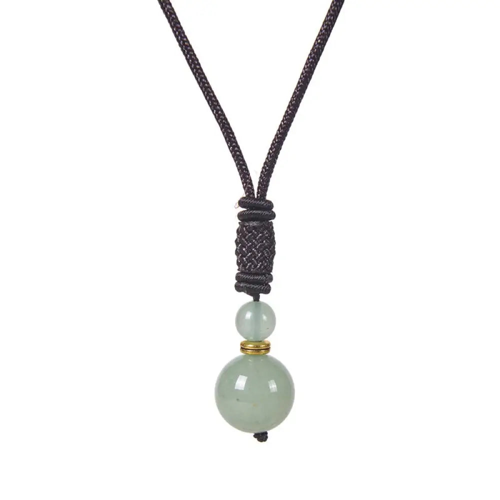 A BWOOOH Tibetan Jade Harmony Necklace, 70cm in length, featuring polished 8mm and 16mm beads of Tiger Eye, Obsidian, Amethyst, Pink Crystal, Jade, and Malachite, designed for spiritual protection and inner peace. - View 10