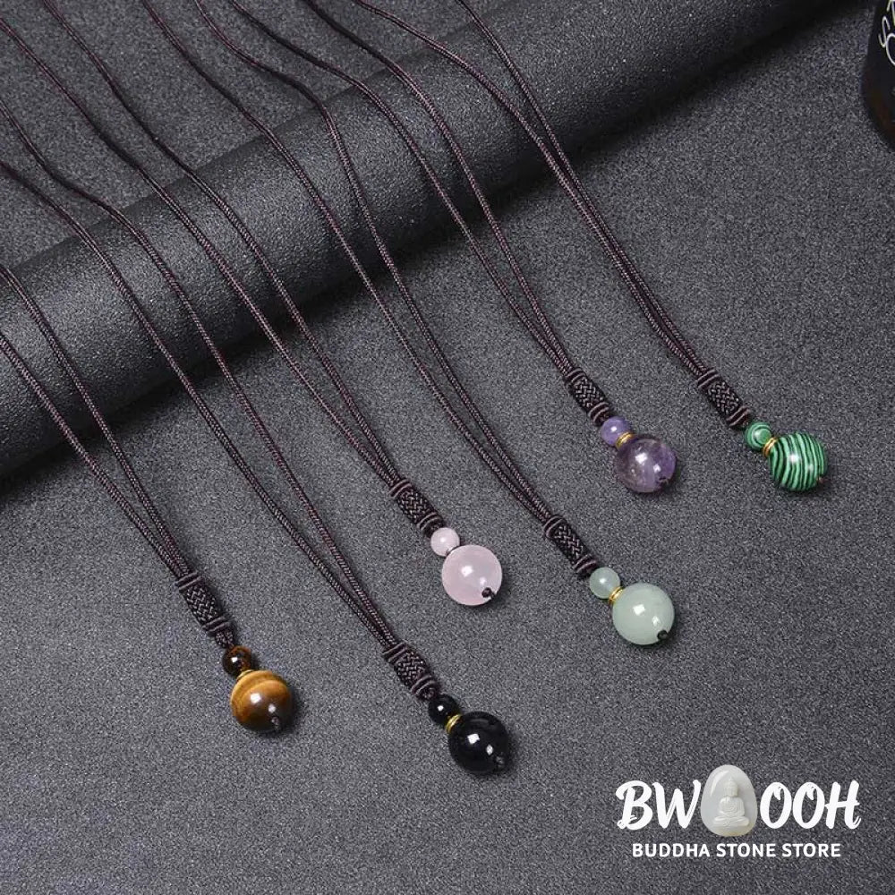 A BWOOOH Tibetan Jade Harmony Necklace, 70cm in length, featuring polished 8mm and 16mm beads of Tiger Eye, Obsidian, Amethyst, Pink Crystal, Jade, and Malachite, designed for spiritual protection and inner peace. - View 14