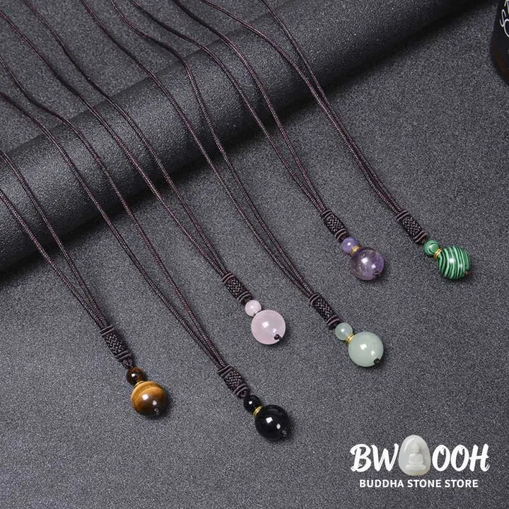 A BWOOOH Tibetan Jade Harmony Necklace, 70cm in length, featuring polished 8mm and 16mm beads of Tiger Eye, Obsidian, Amethyst, Pink Crystal, Jade, and Malachite, designed for spiritual protection and inner peace. - View 14