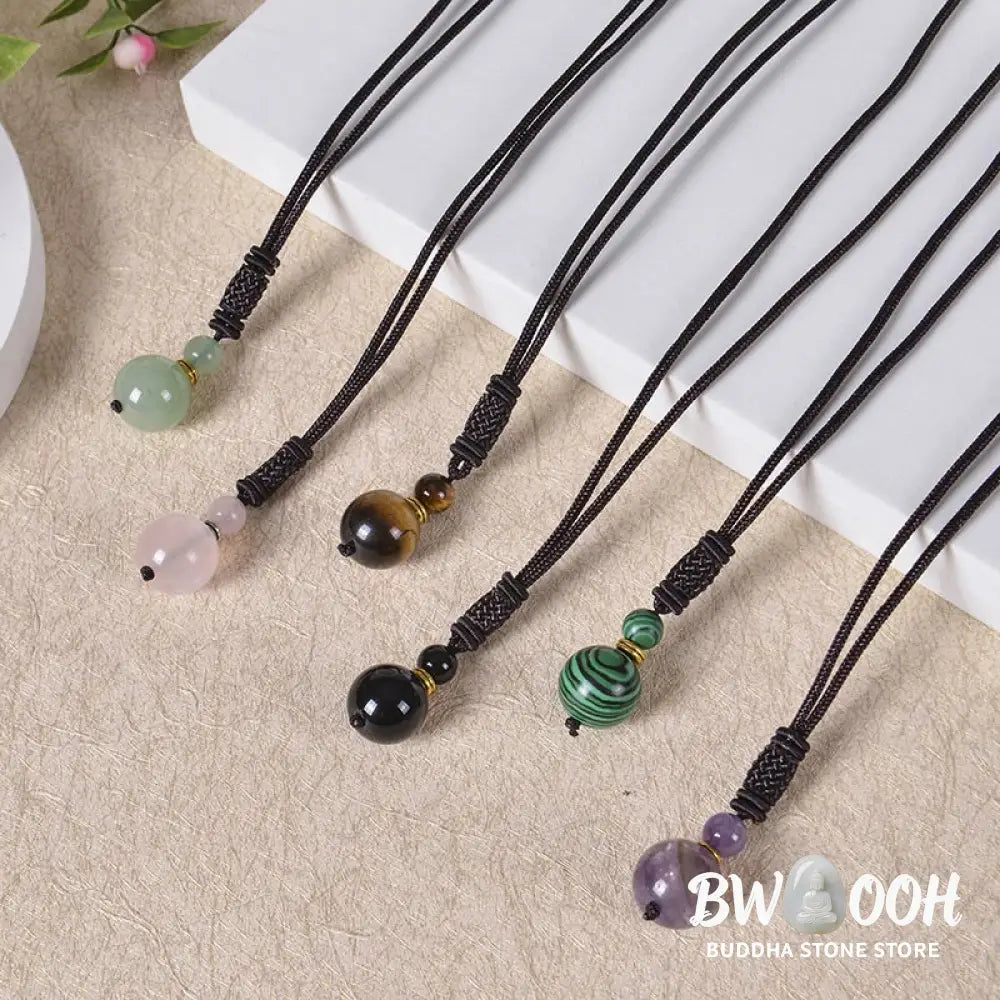 A BWOOOH Tibetan Jade Harmony Necklace, 70cm in length, featuring polished 8mm and 16mm beads of Tiger Eye, Obsidian, Amethyst, Pink Crystal, Jade, and Malachite, designed for spiritual protection and inner peace. - View 15