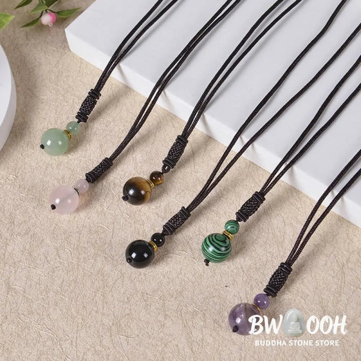 A BWOOOH Tibetan Jade Harmony Necklace, 70cm in length, featuring polished 8mm and 16mm beads of Tiger Eye, Obsidian, Amethyst, Pink Crystal, Jade, and Malachite, designed for spiritual protection and inner peace. - View 15