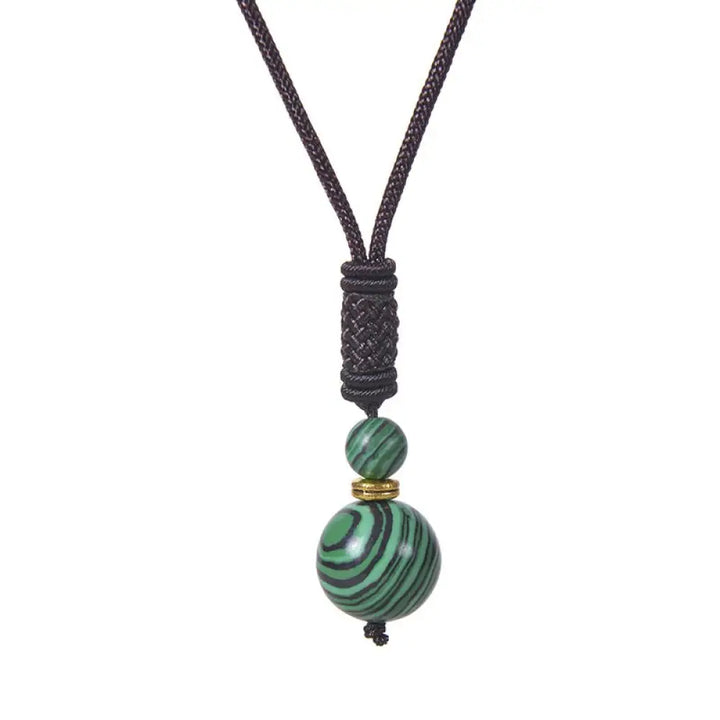 A BWOOOH Tibetan Jade Harmony Necklace, 70cm in length, featuring polished 8mm and 16mm beads of Tiger Eye, Obsidian, Amethyst, Pink Crystal, Jade, and Malachite, designed for spiritual protection and inner peace. - View 12