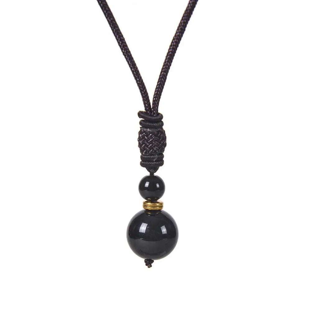 A BWOOOH Tibetan Jade Harmony Necklace, 70cm in length, featuring polished 8mm and 16mm beads of Tiger Eye, Obsidian, Amethyst, Pink Crystal, Jade, and Malachite, designed for spiritual protection and inner peace. - View 4