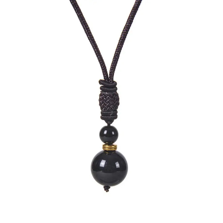 A BWOOOH Tibetan Jade Harmony Necklace, 70cm in length, featuring polished 8mm and 16mm beads of Tiger Eye, Obsidian, Amethyst, Pink Crystal, Jade, and Malachite, designed for spiritual protection and inner peace. - View 4