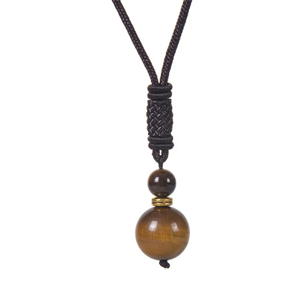 A BWOOOH Tibetan Jade Harmony Necklace, 70cm in length, featuring polished 8mm and 16mm beads of Tiger Eye, Obsidian, Amethyst, Pink Crystal, Jade, and Malachite, designed for spiritual protection and inner peace. - View 2