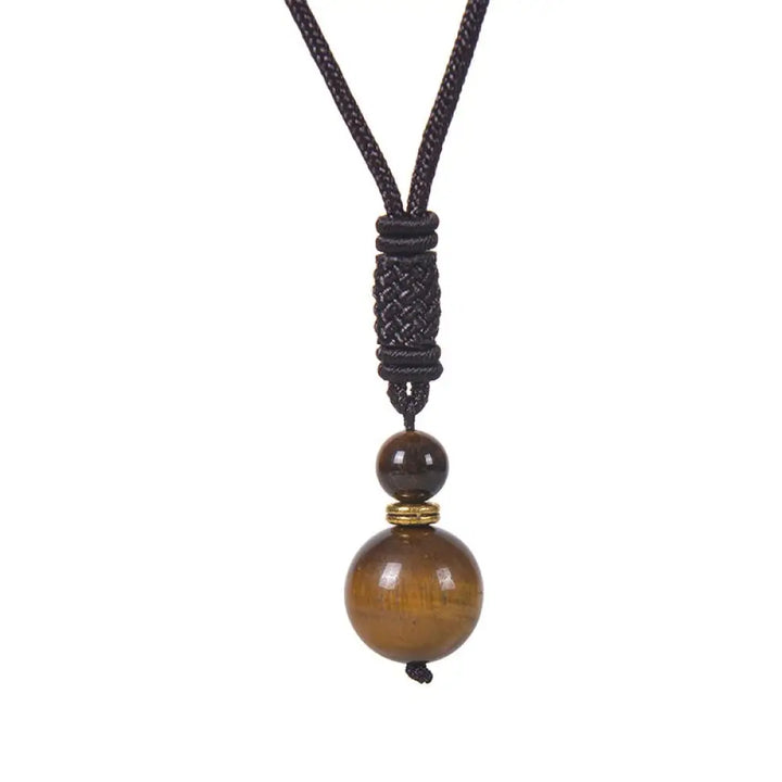 A BWOOOH Tibetan Jade Harmony Necklace, 70cm in length, featuring polished 8mm and 16mm beads of Tiger Eye, Obsidian, Amethyst, Pink Crystal, Jade, and Malachite, designed for spiritual protection and inner peace. - View 2