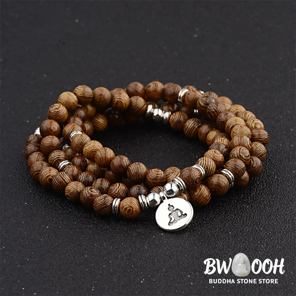 A BWOOOH Tibetan Lightning Strike Wood Mala Bracelet, 46cm circumference, featuring distinct lightning bolt markings, accented with a silver-colored Lotus symbol and a peaceful Buddha charm. - View 4