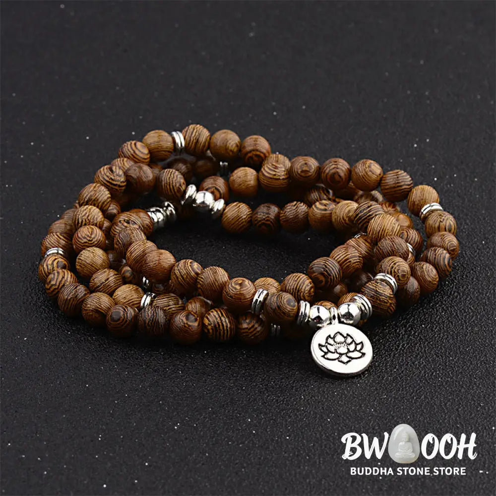 A BWOOOH Tibetan Lightning Strike Wood Mala Bracelet, 46cm circumference, featuring distinct lightning bolt markings, accented with a silver-colored Lotus symbol and a peaceful Buddha charm. - View 5