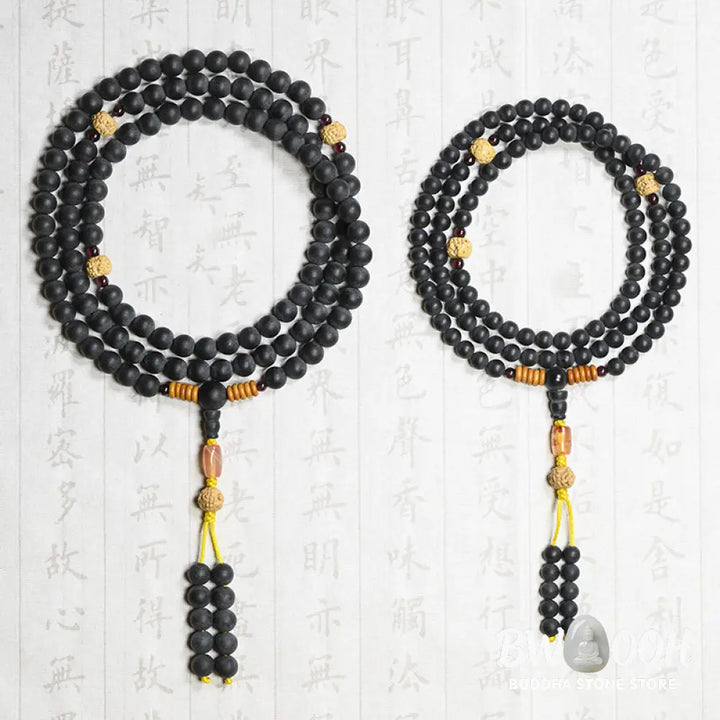 BWOOOH authentic Tibetan Mala bracelet or necklace crafted with 108 polished Cypress beads, distinctive dark-speckled Bodhi Seeds, vibrant Red Agate, and deep Garnet accents, embodying spiritual protection and healing energy. - View 13