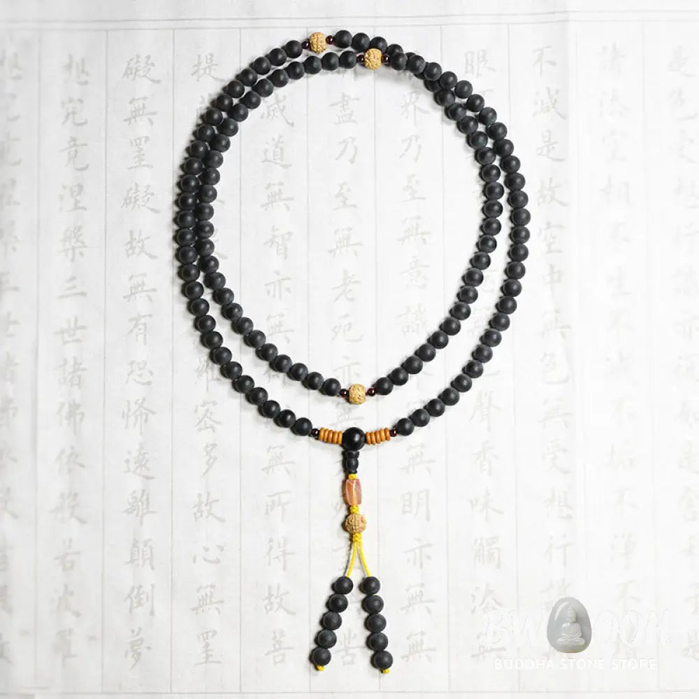 BWOOOH authentic Tibetan Mala bracelet or necklace crafted with 108 polished Cypress beads, distinctive dark-speckled Bodhi Seeds, vibrant Red Agate, and deep Garnet accents, embodying spiritual protection and healing energy. - View 11