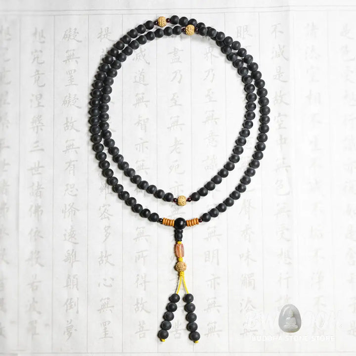 BWOOOH authentic Tibetan Mala bracelet or necklace crafted with 108 polished Cypress beads, distinctive dark-speckled Bodhi Seeds, vibrant Red Agate, and deep Garnet accents, embodying spiritual protection and healing energy. - View 11
