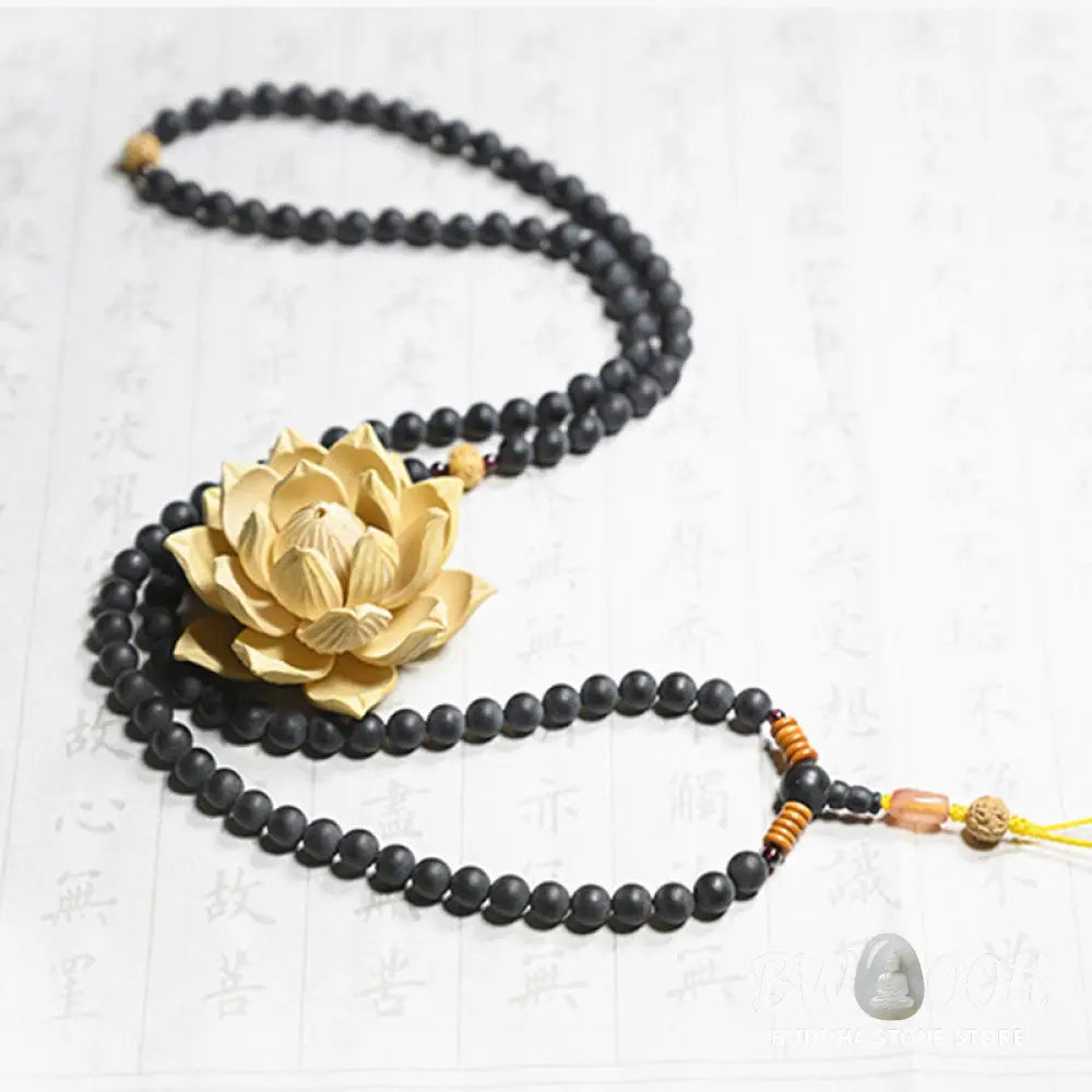 BWOOOH authentic Tibetan Mala bracelet or necklace crafted with 108 polished Cypress beads, distinctive dark-speckled Bodhi Seeds, vibrant Red Agate, and deep Garnet accents, embodying spiritual protection and healing energy. - View 2