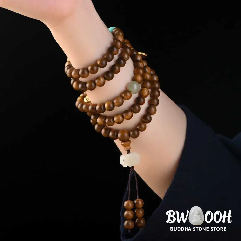 BWOOOH Tibetan Rosewood Protection Calm Bracelet Mala, 108 polished rosewood beads (6mm or 8mm) with red agate, green aventurine, turquoise, and jade accents, evoking protection and calm inspired by ancient Dzi traditions. - View 10