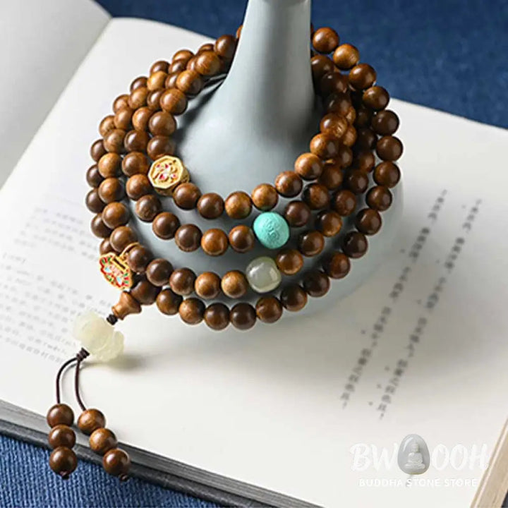 BWOOOH Tibetan Rosewood Protection Calm Bracelet Mala, 108 polished rosewood beads (6mm or 8mm) with red agate, green aventurine, turquoise, and jade accents, evoking protection and calm inspired by ancient Dzi traditions. - View 11