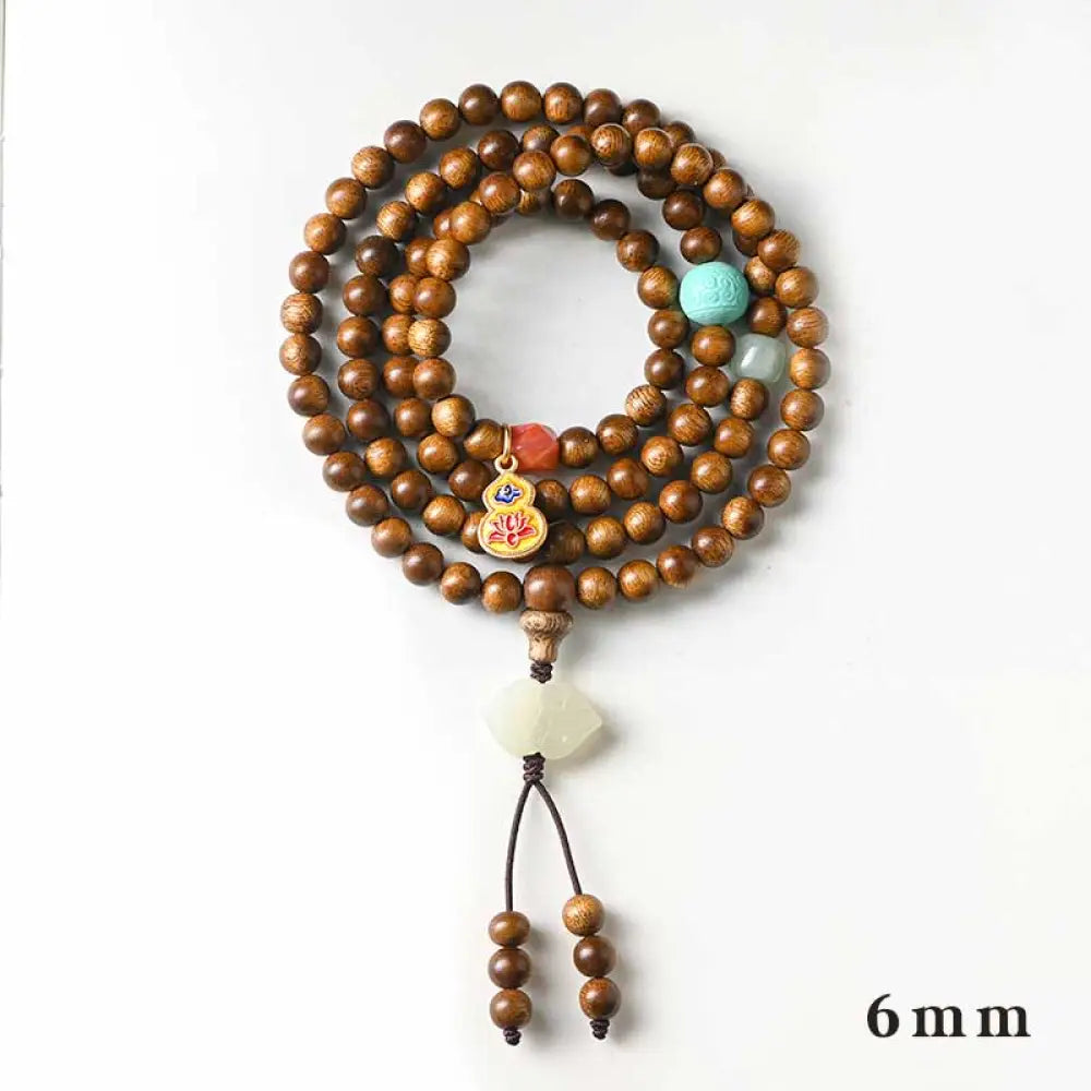 BWOOOH Tibetan Rosewood Protection Calm Bracelet Mala, 108 polished rosewood beads (6mm or 8mm) with red agate, green aventurine, turquoise, and jade accents, evoking protection and calm inspired by ancient Dzi traditions. - View 4