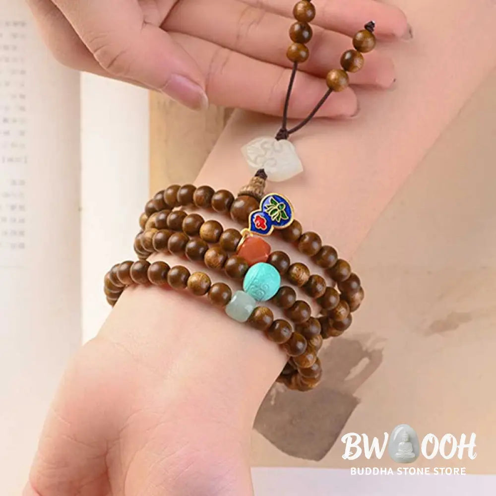 BWOOOH Tibetan Rosewood Protection Calm Bracelet Mala, 108 polished rosewood beads (6mm or 8mm) with red agate, green aventurine, turquoise, and jade accents, evoking protection and calm inspired by ancient Dzi traditions. - View 7