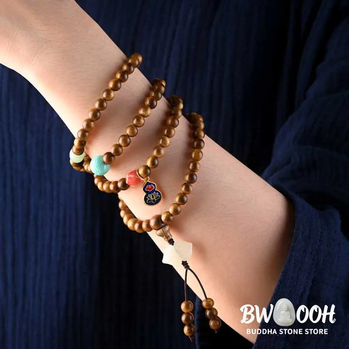BWOOOH Tibetan Rosewood Protection Calm Bracelet Mala, 108 polished rosewood beads (6mm or 8mm) with red agate, green aventurine, turquoise, and jade accents, evoking protection and calm inspired by ancient Dzi traditions. - View 6