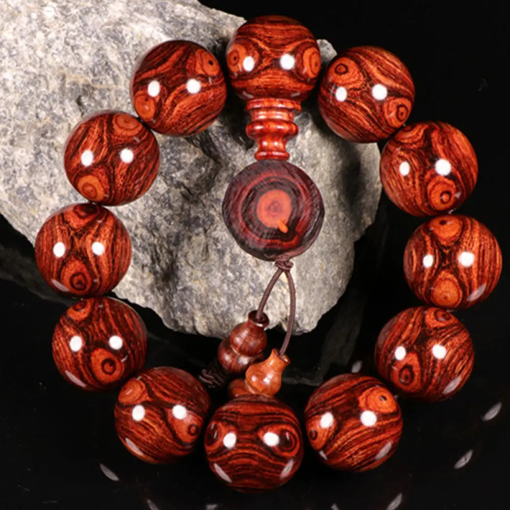 BWOOOH Tibetan Rosewood Warmth Bracelet in a close-up, showcasing either round block or Chinese knotting, with various bead sizes (6mm-30mm), handcrafted for meditation and spiritual protection.