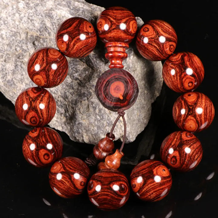 BWOOOH Tibetan Rosewood Warmth Bracelet in a close-up, showcasing either round block or Chinese knotting, with various bead sizes (6mm-30mm), handcrafted for meditation and spiritual protection.