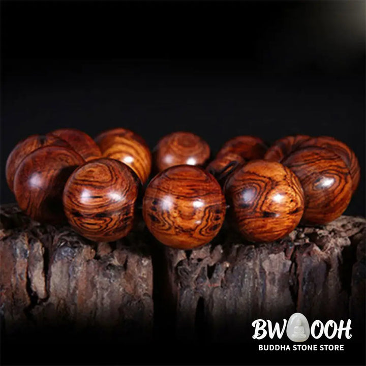 BWOOOH Tibetan Rosewood Warmth Bracelet in a close-up, showcasing either round block or Chinese knotting, with various bead sizes (6mm-30mm), handcrafted for meditation and spiritual protection. - View 4