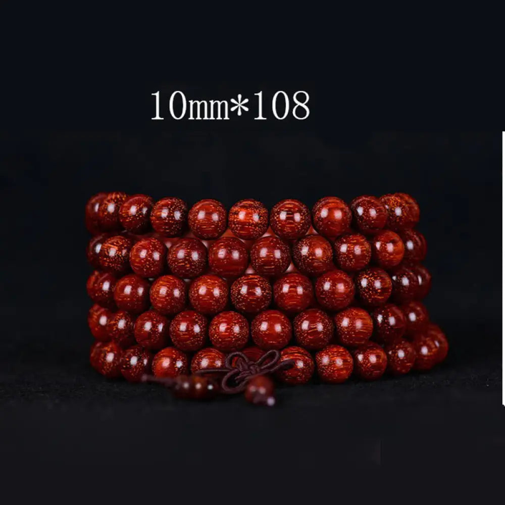 BWOOOH Tibetan Small Leaf Red Sandalwood Balance Bracelet, 108 beads, close-up. Polished dark red wood beads with subtle grain, evoking spiritual protection and calm. - View 5