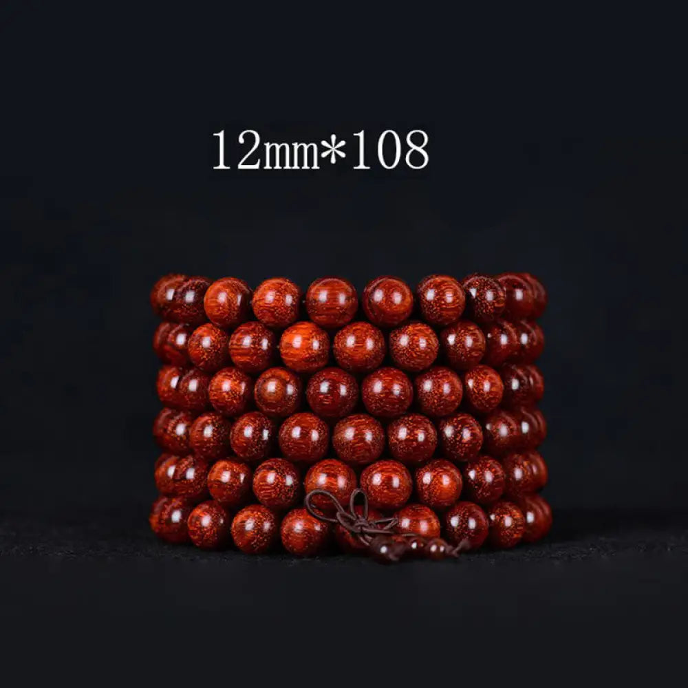 BWOOOH Tibetan Small Leaf Red Sandalwood Balance Bracelet, 108 beads, close-up. Polished dark red wood beads with subtle grain, evoking spiritual protection and calm. - View 6