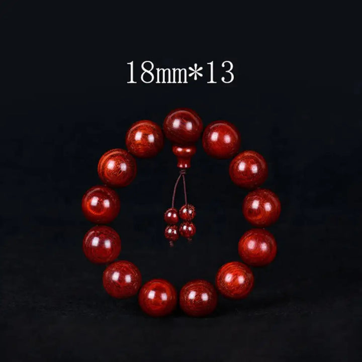 BWOOOH Tibetan Small Leaf Red Sandalwood Balance Bracelet, 108 beads, close-up. Polished dark red wood beads with subtle grain, evoking spiritual protection and calm. - View 10