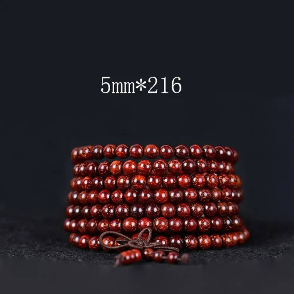 BWOOOH Tibetan Small Leaf Red Sandalwood Balance Bracelet, 108 beads, close-up. Polished dark red wood beads with subtle grain, evoking spiritual protection and calm. - View 8
