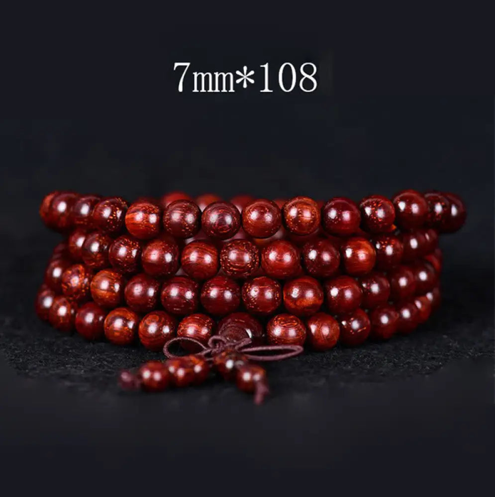 BWOOOH Tibetan Small Leaf Red Sandalwood Balance Bracelet, 108 beads, close-up. Polished dark red wood beads with subtle grain, evoking spiritual protection and calm. - View 3