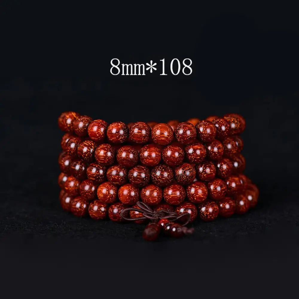 BWOOOH Tibetan Small Leaf Red Sandalwood Balance Bracelet, 108 beads, close-up. Polished dark red wood beads with subtle grain, evoking spiritual protection and calm. - View 4