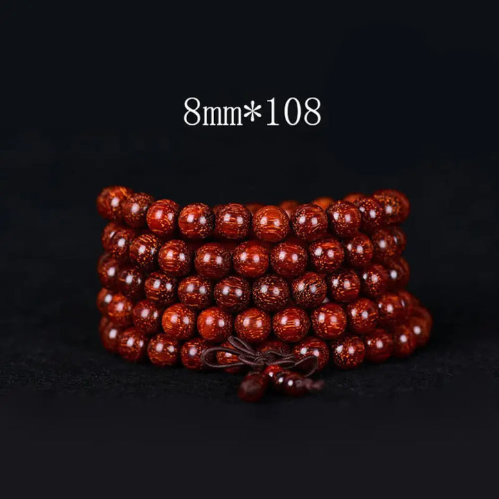 BWOOOH Tibetan Small Leaf Red Sandalwood Balance Bracelet, 108 beads, close-up. Polished dark red wood beads with subtle grain, evoking spiritual protection and calm. - View 4