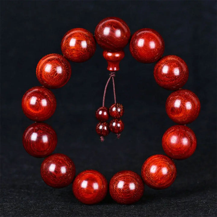 BWOOOH Tibetan Small Leaf Red Sandalwood Balance Bracelet, 108 beads, close-up. Polished dark red wood beads with subtle grain, evoking spiritual protection and calm.