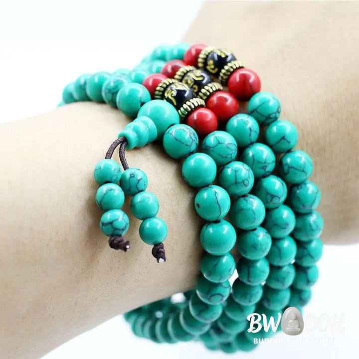 Close-up of a BWOOOH Tibetan Turquoise Purification Necklace Mala, featuring 8mm beads of vibrant blue turquoise, deep black onyx, rich red agate, and polished copper, strung as a 108-bead mala. The intricate details highlight its craftsmanship and spiritual significance. - View 6