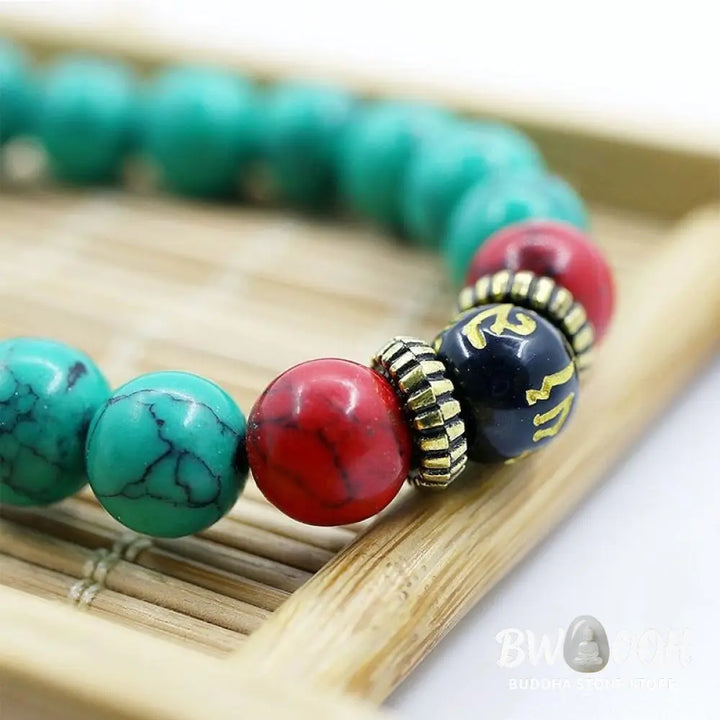Close-up of a BWOOOH Tibetan Turquoise Purification Necklace Mala, featuring 8mm beads of vibrant blue turquoise, deep black onyx, rich red agate, and polished copper, strung as a 108-bead mala. The intricate details highlight its craftsmanship and spiritual significance. - View 3