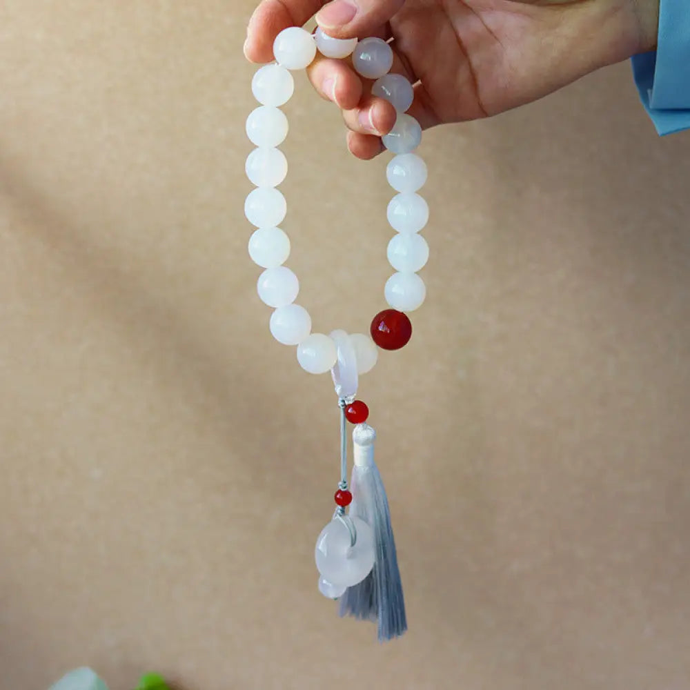 BWOOOH White Agate Red Agate Luck Wrist Mala with tassels, featuring 12mm-14mm beads, for meditation, pocket charm, or car decoration, symbolizing clarity, peace, and confidence.