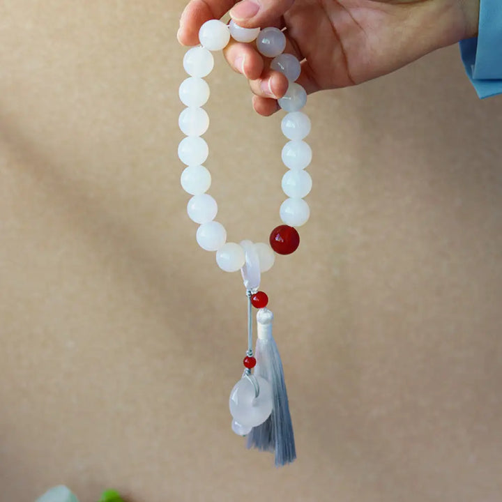 BWOOOH White Agate Red Agate Luck Wrist Mala with tassels, featuring 12mm-14mm beads, for meditation, pocket charm, or car decoration, symbolizing clarity, peace, and confidence.