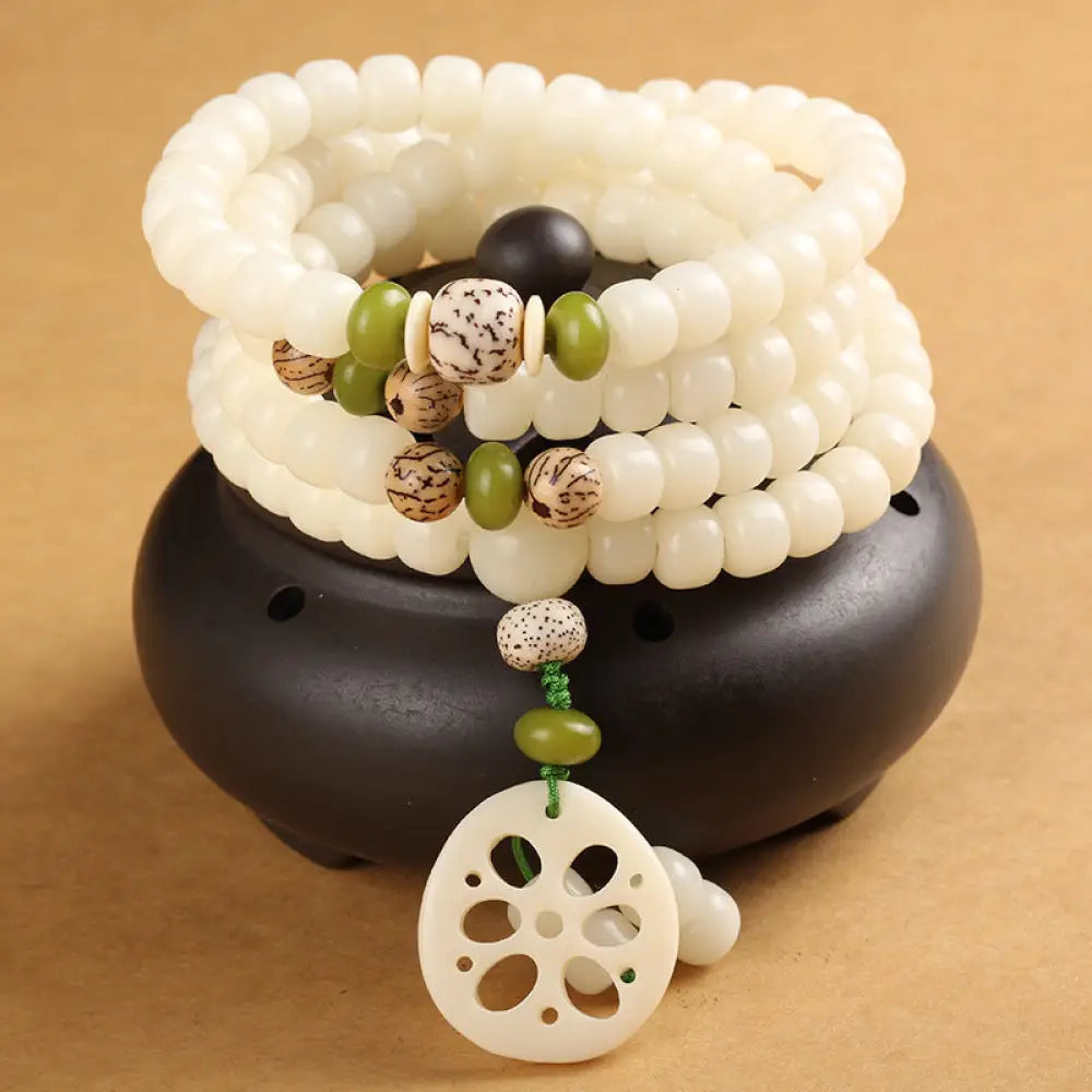 BWOOOH Handcrafted White Bodhi Seed Mala 108 Bead Luck Bracelet. Natural dark-speckled seeds for spiritual focus and mindful meditation.