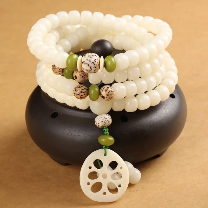 BWOOOH Handcrafted White Bodhi Seed Mala 108 Bead Luck Bracelet. Natural dark-speckled seeds for spiritual focus and mindful meditation.