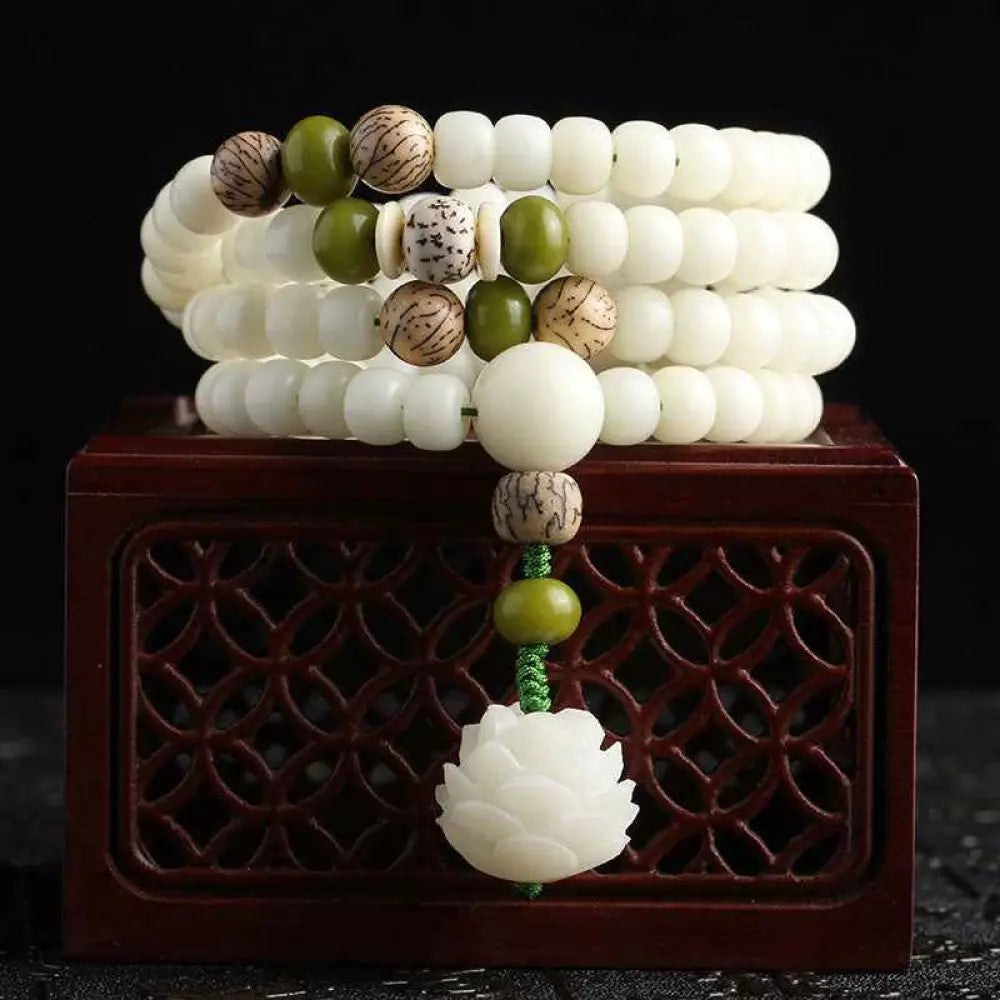 BWOOOH White Jade Bodhi Lotus Mala Harmony Necklace Bracelet with 108 naturally pale Bodhi seeds and a delicate lotus pendant, embodying purity and spiritual awakening for meditation and daily wear.