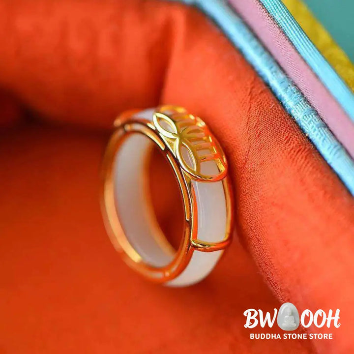 BWOOOH White Jade Luck Ring Necklace featuring a smooth white jade ring, intricately wrapped in copper wire with a prominent lucky knot symbol. The versatile piece is shown as a spiritual pendant on its included chain, suitable for unisex wear. - View 3