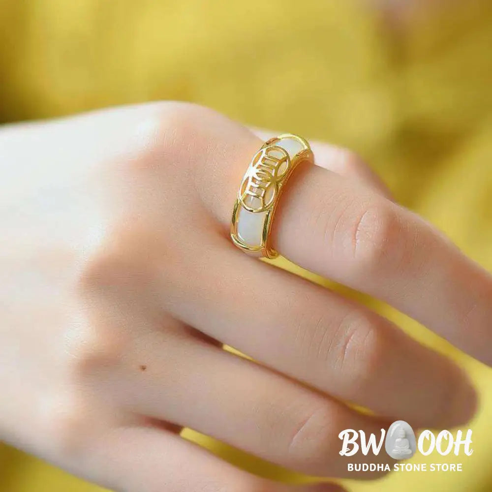 BWOOOH White Jade Luck Ring Necklace featuring a smooth white jade ring, intricately wrapped in copper wire with a prominent lucky knot symbol. The versatile piece is shown as a spiritual pendant on its included chain, suitable for unisex wear. - View 2
